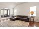Comfortable living room with vaulted ceiling, plentiful light, and hardwood flooring at 2737 Casper Creek Ln, Raleigh, NC 27616