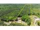 Expansive aerial view showcases the estate's generous property lines and lush, wooded surroundings at 3005 Buckhorn Rd, Sanford, NC 27330