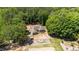 Aerial view showcasing the home nestled amongst lush greenery at 3005 Buckhorn Rd, Sanford, NC 27330