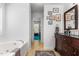 Bathroom with a spacious vanity, decorative wall art, and a tiled floor that adds a touch of elegance at 3005 Buckhorn Rd, Sanford, NC 27330