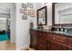 Elegant bathroom featuring a double vanity with a dark wood cabinet and stylish decor at 3005 Buckhorn Rd, Sanford, NC 27330