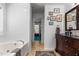 Spacious bathroom with a soaking tub, a vanity, and lots of natural light at 3005 Buckhorn Rd, Sanford, NC 27330