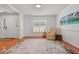 Comfortable living room featuring neutral walls, hardwood floors, and a cozy armchair at 3005 Buckhorn Rd, Sanford, NC 27330