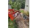 Several trees and shrubs in containers, ready to be planted, offering a homeowner a chance to personalize landscaping at 3005 Buckhorn Rd, Sanford, NC 27330