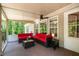 Screened-in porch with comfortable seating, offering a serene space to enjoy the outdoors without insects at 3005 Buckhorn Rd, Sanford, NC 27330