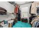 Organized walk-in closet with built-in shelving and racks, providing ample storage space for clothing and accessories at 3005 Buckhorn Rd, Sanford, NC 27330