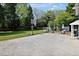 Spacious backyard with a concrete patio, green grass, basketball hoop, and patio seating area at 310 Henderson St, Oxford, NC 27565