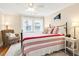 Cozy bedroom features a queen-sized bed, chair, and bright natural light at 310 Henderson St, Oxford, NC 27565