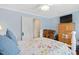 Comfortable bedroom in soft hues with bed and built in dresser at 310 Henderson St, Oxford, NC 27565