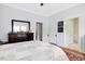 Spacious bedroom featuring hardwood floors, trim, and large windows at 310 Henderson St, Oxford, NC 27565