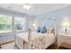 Comfortable bedroom in soft hues with two large windows at 310 Henderson St, Oxford, NC 27565