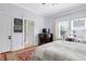 Bright bedroom featuring an en suite bathroom and a walk-in closet at 310 Henderson St, Oxford, NC 27565