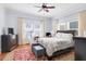 Comfortable bedroom featuring natural light, hardwood floors, and cozy decor at 310 Henderson St, Oxford, NC 27565