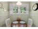 Bright breakfast nook featuring comfortable seating and natural light through large windows at 310 Henderson St, Oxford, NC 27565