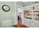 Bright breakfast nook offering built-in cabinets and a view into the adjacent dining room at 310 Henderson St, Oxford, NC 27565