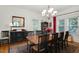 Elegant dining room with stylish chandelier and classic wood furniture for sophisticated dining at 310 Henderson St, Oxford, NC 27565
