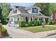 Beautiful two-story home with a covered porch, flagpole, and well-maintained landscaping at 310 Henderson St, Oxford, NC 27565