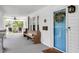 Spacious front porch with seating, fan, and a view of the beautifully landscaped yard at 310 Henderson St, Oxford, NC 27565