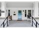 Charming front porch with rocking chair, decorative door, and classic architectural details at 310 Henderson St, Oxford, NC 27565