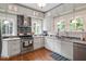Well-equipped kitchen featuring granite countertops and stainless steel appliances at 310 Henderson St, Oxford, NC 27565