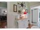 Open kitchen featuring beadboard paneling, tiled floors, and butcher block island at 310 Henderson St, Oxford, NC 27565
