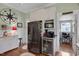Bright kitchen featuring stainless steel refrigerator, bar area, and breakfast nook at 310 Henderson St, Oxford, NC 27565