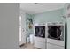 Laundry room featuring side-by-side washer and dryer and access to the yard at 310 Henderson St, Oxford, NC 27565