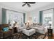 Inviting living room featuring neutral furniture, dark accents, and plenty of natural light at 310 Henderson St, Oxford, NC 27565