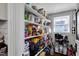 Walk-in pantry featuring shelves of assorted pantry items at 310 Henderson St, Oxford, NC 27565