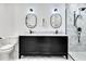 Elegant bathroom featuring double vanity, modern lighting, marble floors, and glass shower at 318 Hepowil Trce, Hillsborough, NC 27278