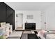 bedroom featuring gray geometric rug, black dresser, and modern decor at 318 Hepowil Trce, Hillsborough, NC 27278