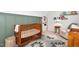 Well decorated Bedroom featuring board and batten accent wall and vintage style furnishings at 318 Hepowil Trce, Hillsborough, NC 27278
