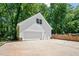 Spacious two-car garage with a full-height ceiling and wide driveway, providing ample parking space at 318 Hepowil Trce, Hillsborough, NC 27278