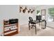 Bright office space featuring neutral walls, dark wood desk, and unique deer head decor at 318 Hepowil Trce, Hillsborough, NC 27278