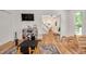 Well-lit playroom with light wood floors, play table, and access to the staircase at 318 Hepowil Trce, Hillsborough, NC 27278