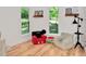 Bright playroom featuring hardwood floors, large windows, and a reading area at 318 Hepowil Trce, Hillsborough, NC 27278