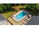 Overhead view of a lovely swimming pool with patio furniture and a charming outdoor space for entertaining at 318 Hepowil Trce, Hillsborough, NC 27278