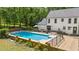 Beautiful in-ground swimming pool with a large patio deck, perfect for summer relaxation and outdoor gatherings at 318 Hepowil Trce, Hillsborough, NC 27278