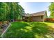 Spacious backyard includes screened porch, new wooden fence, and well maintained lawn at 33 Carrington Cir, Angier, NC 27501