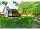 Home featuring a large backyard, with an enclosed porch at 33 Carrington Cir, Angier, NC 27501