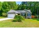 Charming single-story home with a two-car garage and landscaped front yard at 33 Carrington Cir, Angier, NC 27501