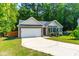 Charming single-story home with a two-car garage and landscaped front yard at 33 Carrington Cir, Angier, NC 27501