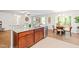 Open kitchen with stainless steel appliances, wood cabinets, a granite countertop and view of dining area at 33 Carrington Cir, Angier, NC 27501