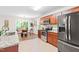 Open floor plan featuring a kitchen with stainless steel appliances, wood cabinets, and granite countertops at 33 Carrington Cir, Angier, NC 27501