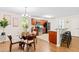 Modern kitchen with stainless steel appliances, wood cabinets, granite countertops, and breakfast bar seating at 33 Carrington Cir, Angier, NC 27501