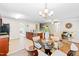 Open floor plan featuring a kitchen with stainless steel appliances and a glass table with chairs at 33 Carrington Cir, Angier, NC 27501