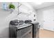 Laundry room with side-by-side washer and dryer and shelving at 33 Carrington Cir, Angier, NC 27501