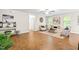 Spacious living area featuring stylish decor, ample seating, and wood floors at 33 Carrington Cir, Angier, NC 27501