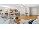 Open-concept living space with wood floors, eat-in kitchen, and dining area at 33 Carrington Cir, Angier, NC 27501