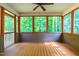 Enclosed porch offering views of the green forest at 33 Carrington Cir, Angier, NC 27501